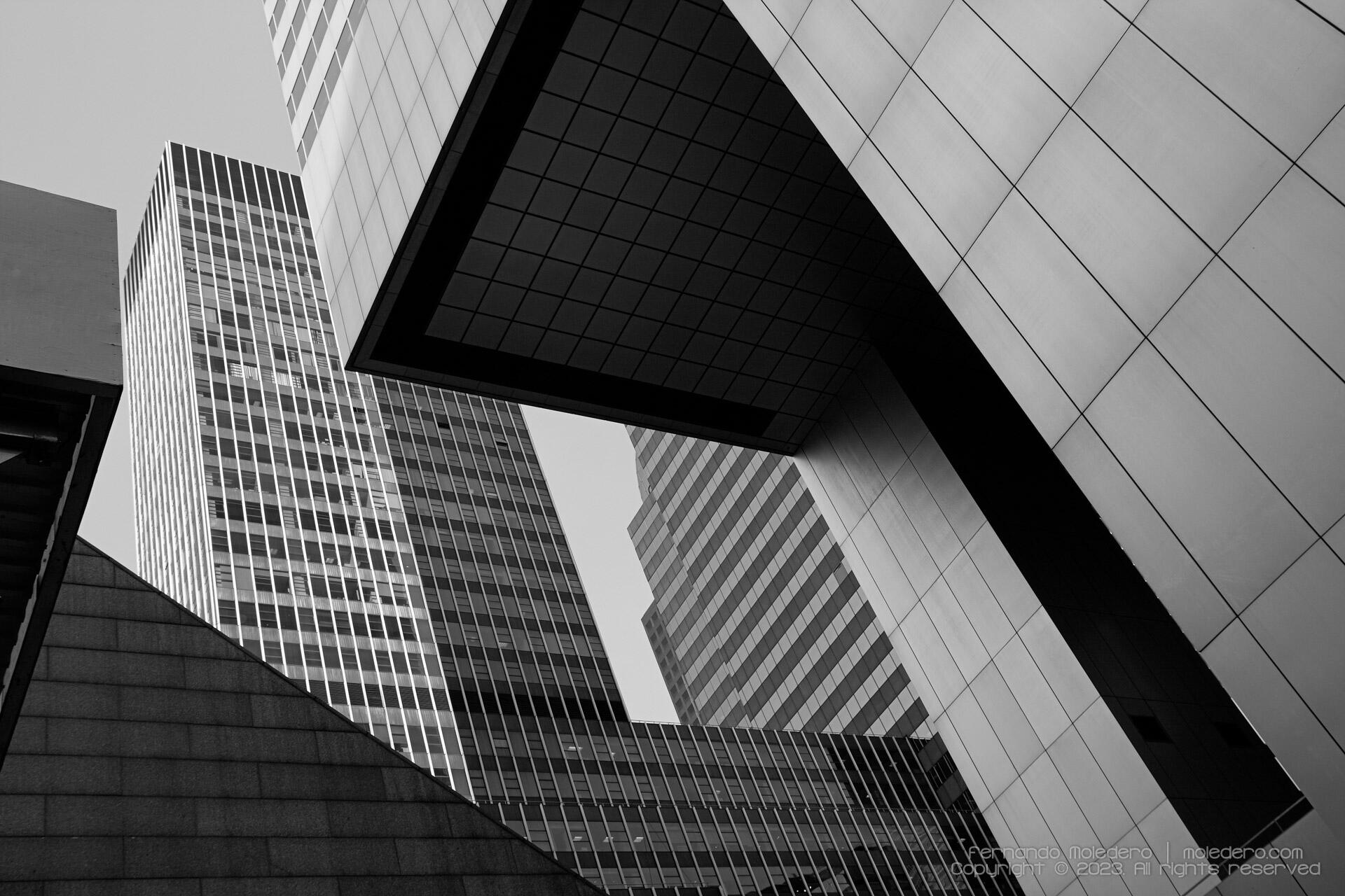 Black and white architectural composition of skyscrapers in Manhattan, New York, USA, highlighting geometric lines, sharp contrasts and modern building facades